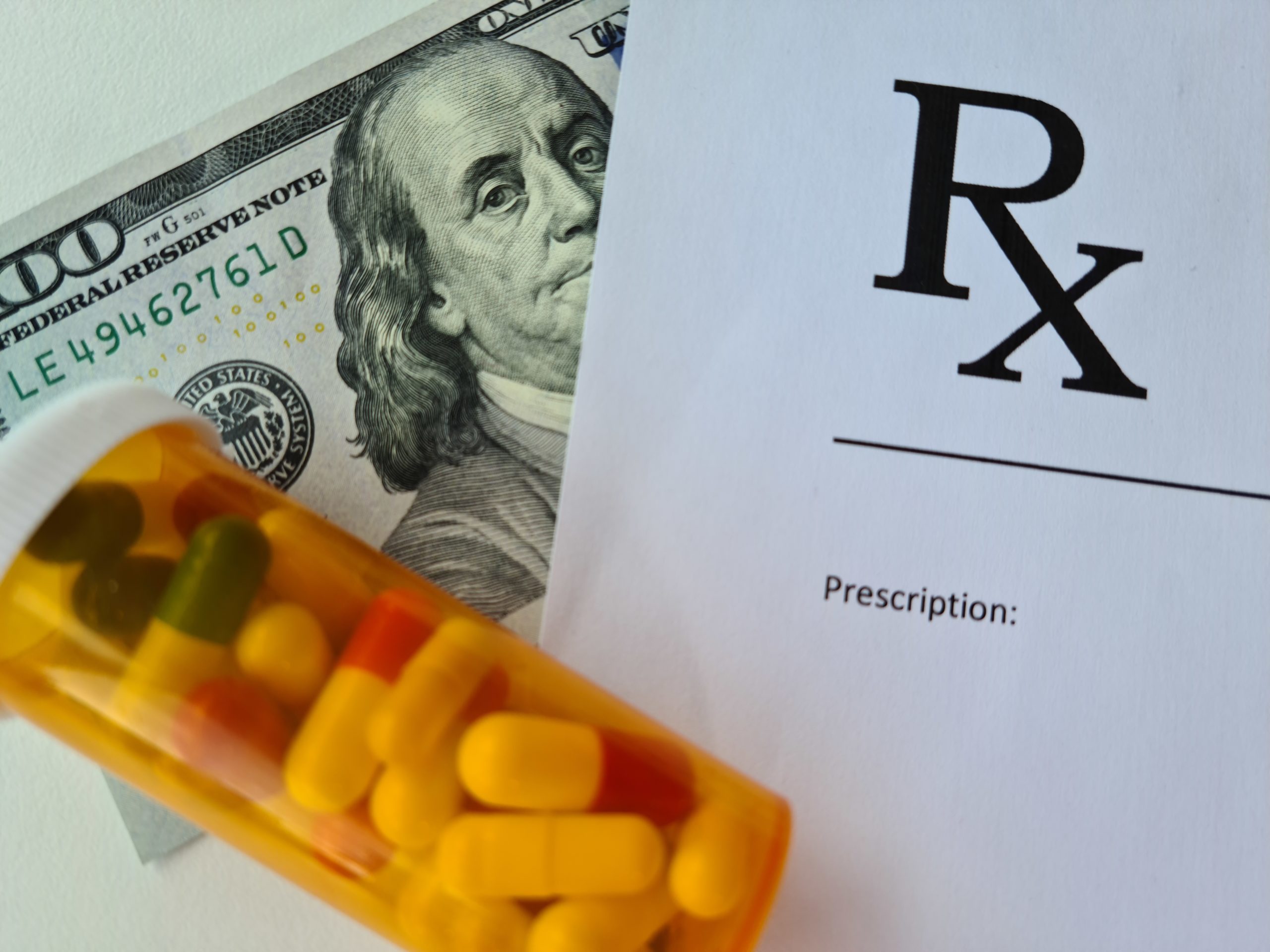 Rx with cash and pills – GettyImages-1399981576